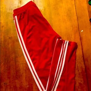 Red adidas track pants
